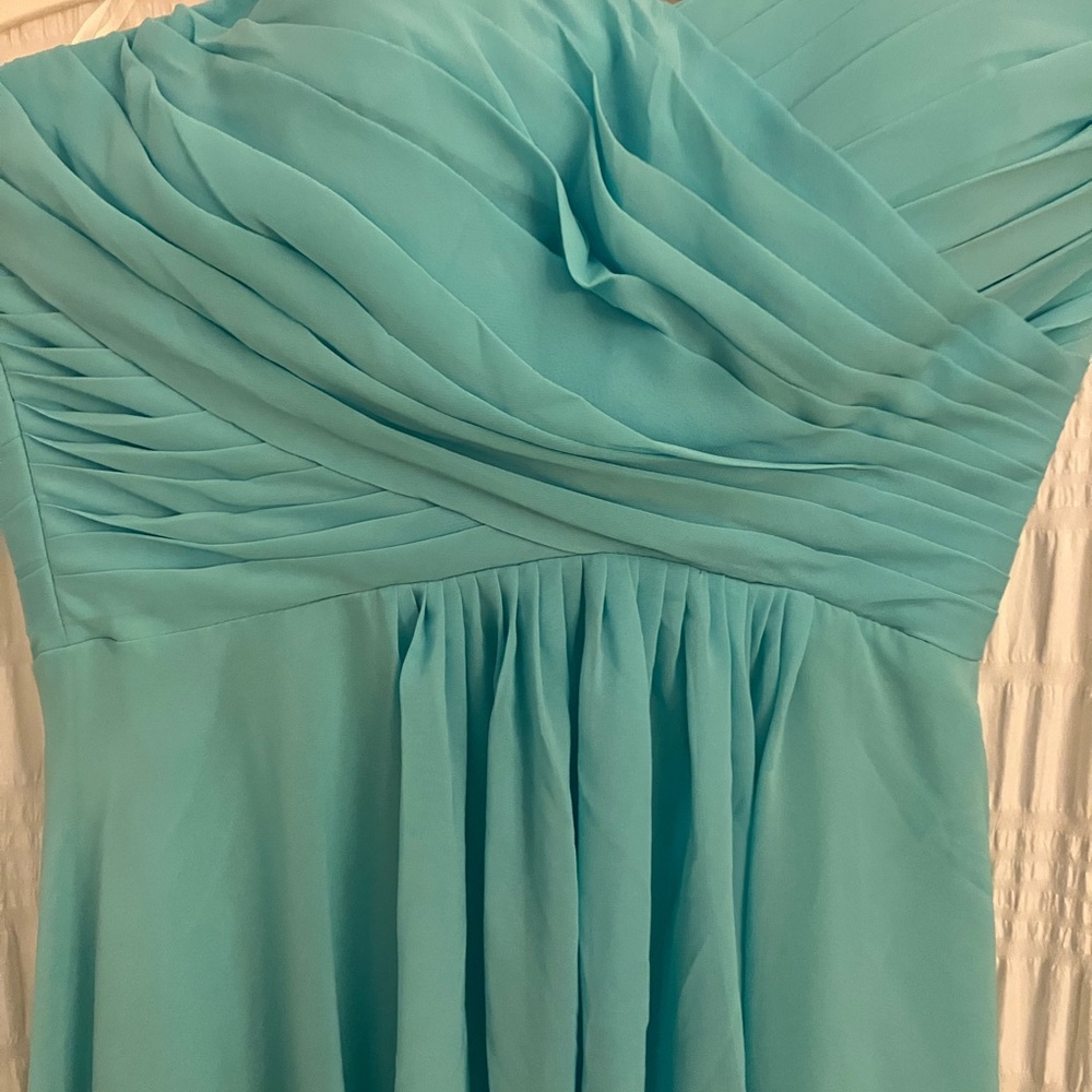 New without tags.  Tiffany blue prom/homecoming dress. Never worn. maxi length.